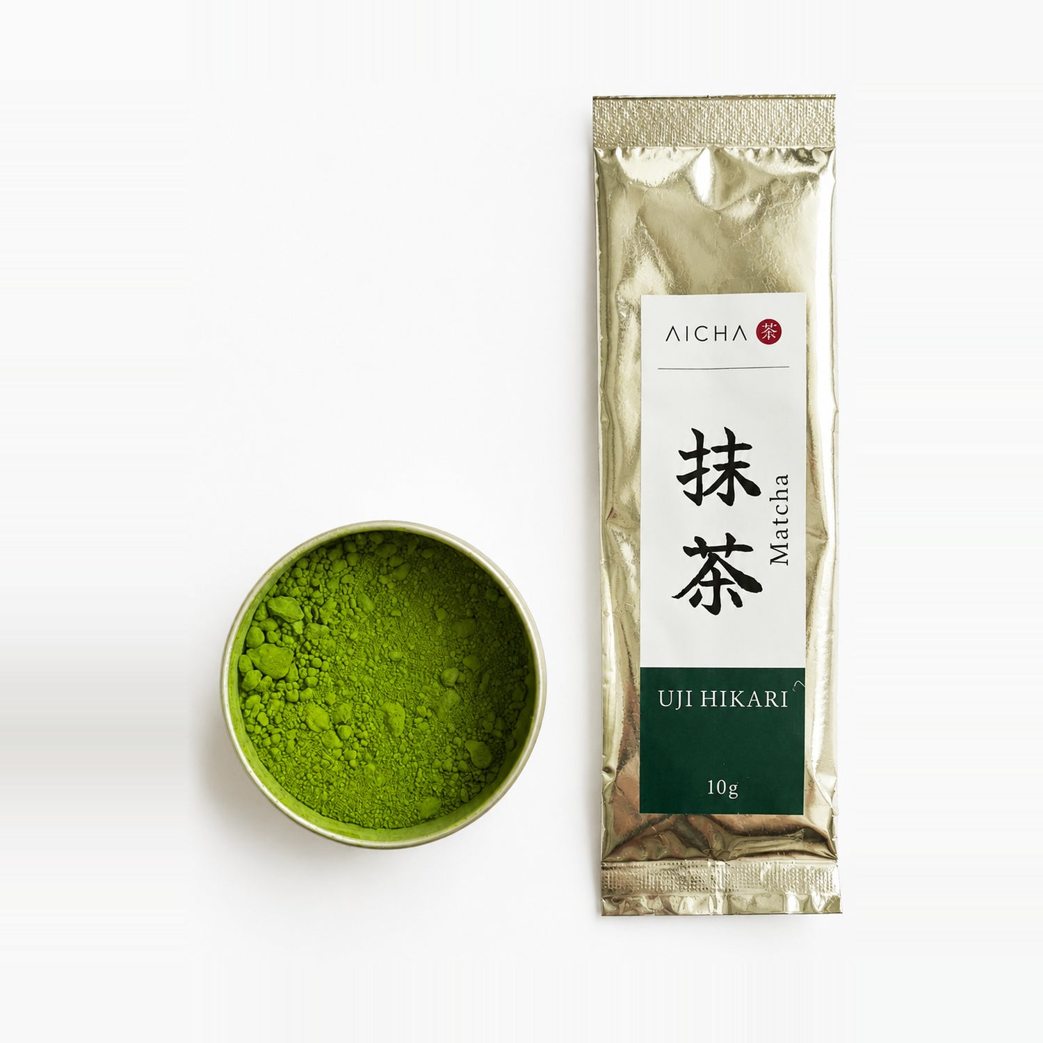 AiCha Uji Hikari sachet standing beside an open tin of matcha