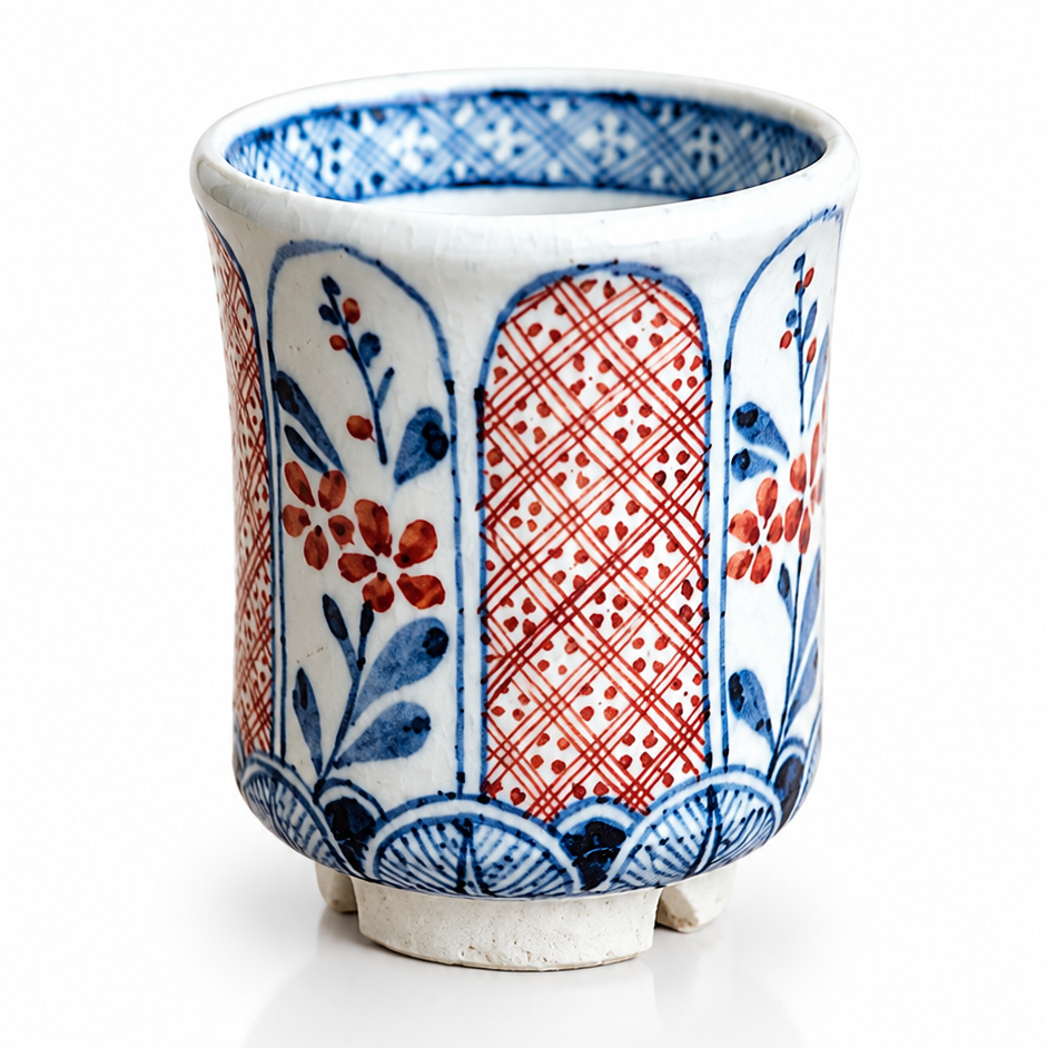 Traditional Japanese ceramic tea cup with red and blue motifs