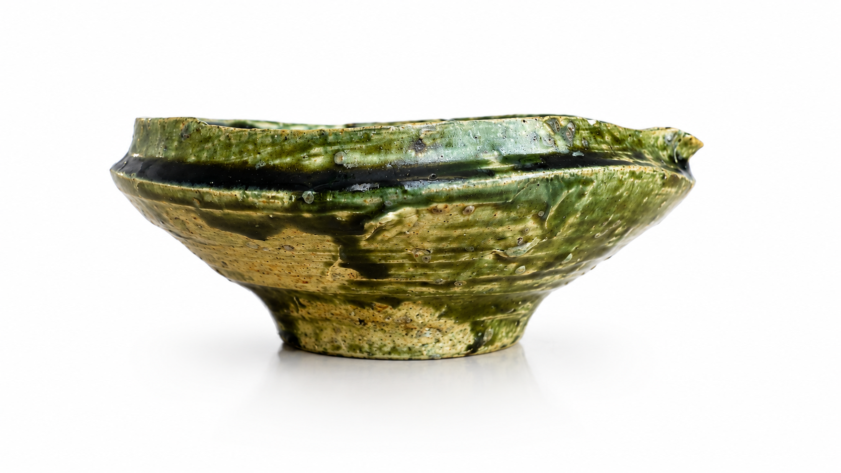Traditional Japanese ceramic katakuchi with organic form and pouring spout.