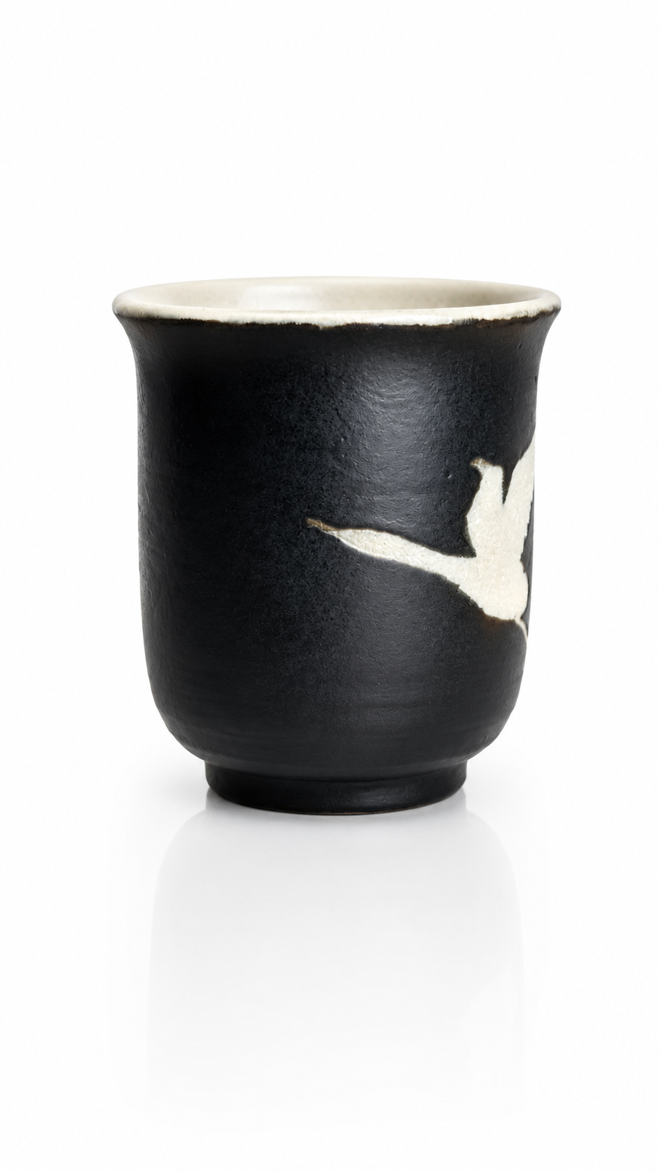 Signed handcrafted Japanese ceramic yunomi by Fukuda with matte black finish.