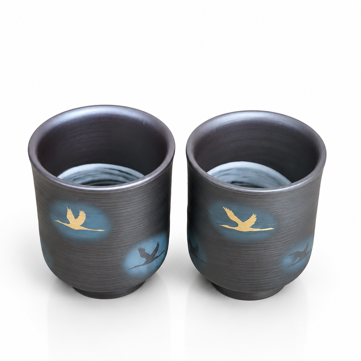 Artisan Japanese pottery tea cup pair